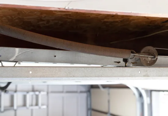 Should You DIY Garage Door Repairs? AdobeStock 892899081 1 Garage door springs that are rusted and need repair from garage door services Elgin.